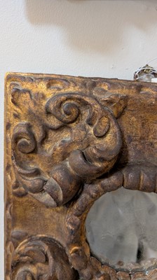 Lot 10 - A baroque carved and giltwood wall mirror