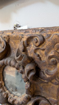 Lot 10 - A baroque carved and giltwood wall mirror