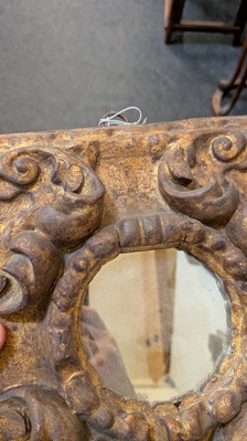 Lot 10 - A baroque carved and giltwood wall mirror