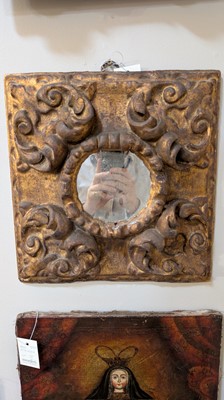 Lot 10 - A baroque carved and giltwood wall mirror