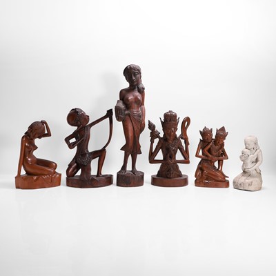Lot 387 - A group of carved wood figures
