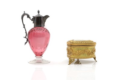 Lot 33 - A silver mounted cranberry glass claret jug
