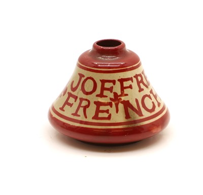 Lot 113 - A small red lustre ware inkwell