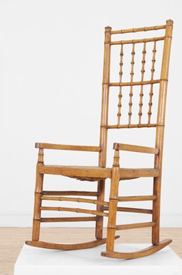 Lot 85 - An ash faux bamboo rocking chair
