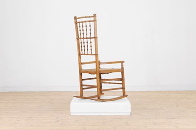 Lot 85 - An ash faux bamboo rocking chair