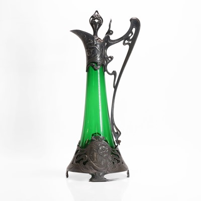 Lot 170 - A German Art Nouveau pewter and glass claret jug