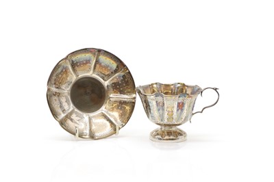 Lot 38 - A silver teacup and saucer