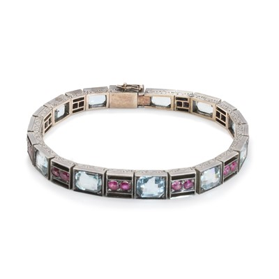 Lot 86 - An aquamarine and ruby line bracelet, c.1950