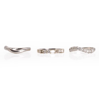 Lot 308 - Two diamond half eternity rings and a platinum band