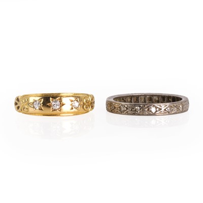 Lot 255 - An Edwardian diamond three stone ring and a diamond eternity ring