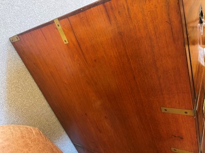 Lot 74 - A Victorian teak and brass secretaire campaign chest