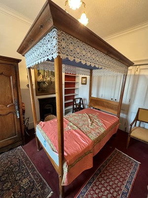 Lot 683 - A fruitwood single four poster bed