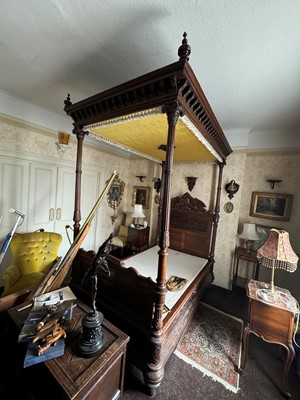 Lot 682 - A carved oak four poster single bed
