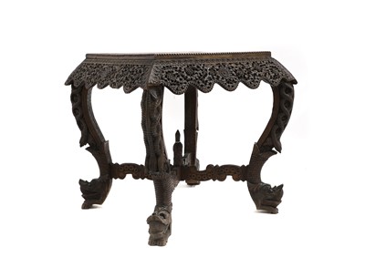 Lot 459 - A carved hardwood occasional table