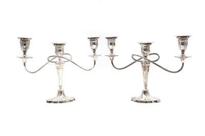 Lot 7 - A pair of silver three-branch candelabra