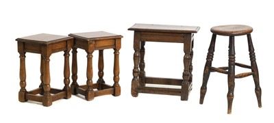 Lot 692 - A group of four oak joined stools
