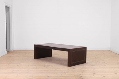 Lot 90 - A leather and chrome coffee table