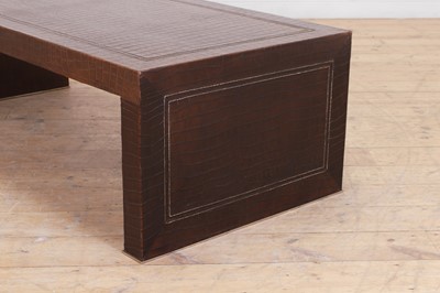 Lot 90 - A leather and chrome coffee table