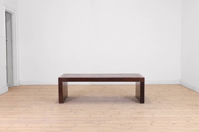 Lot 90 - A leather and chrome coffee table