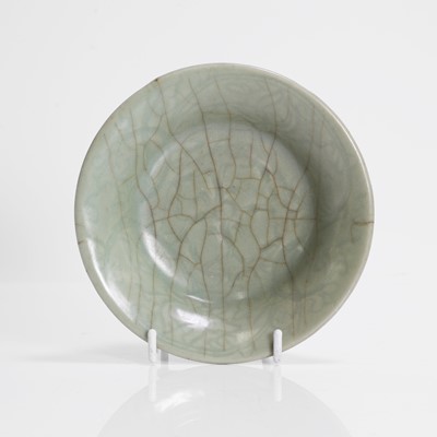 Lot 21 - A Chinese celadon-glazed saucer
