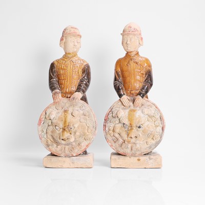 Lot 29 - A pair of Chinese pottery warriors