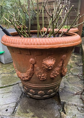 Lot 708 - A set of three terracotta garden jardinieres