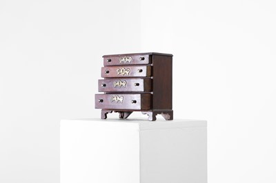 Lot 684 - A miniature mahogany chest of drawers