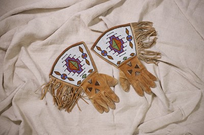 Lot 304 - A pair of Native American beaded hide gauntlets