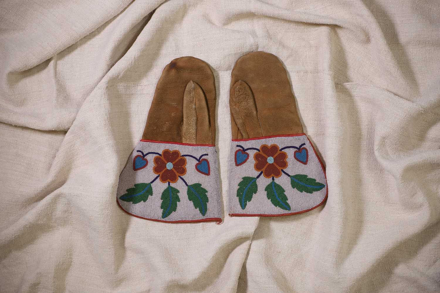 Lot 312 - A pair of Native American beaded hide mittens