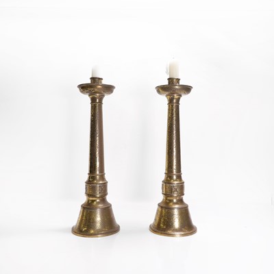 Lot 257 - A pair of brass altar candlesticks