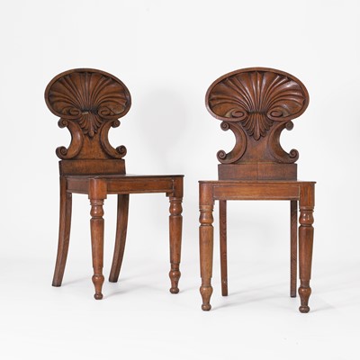Lot 32 - A pair of Regency oak hall chairs