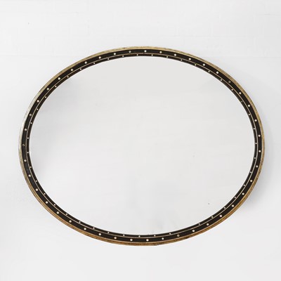 Lot 142 - A large oval mirror