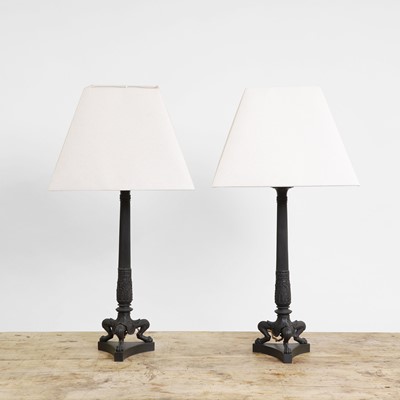 Lot 140 - A pair of Empire-style bronze lamps