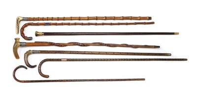 Lot 55 - A group of seven silver and gold mounted walking sticks