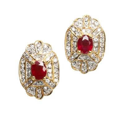 Lot 102 - A pair of ruby and diamond cluster earrings
