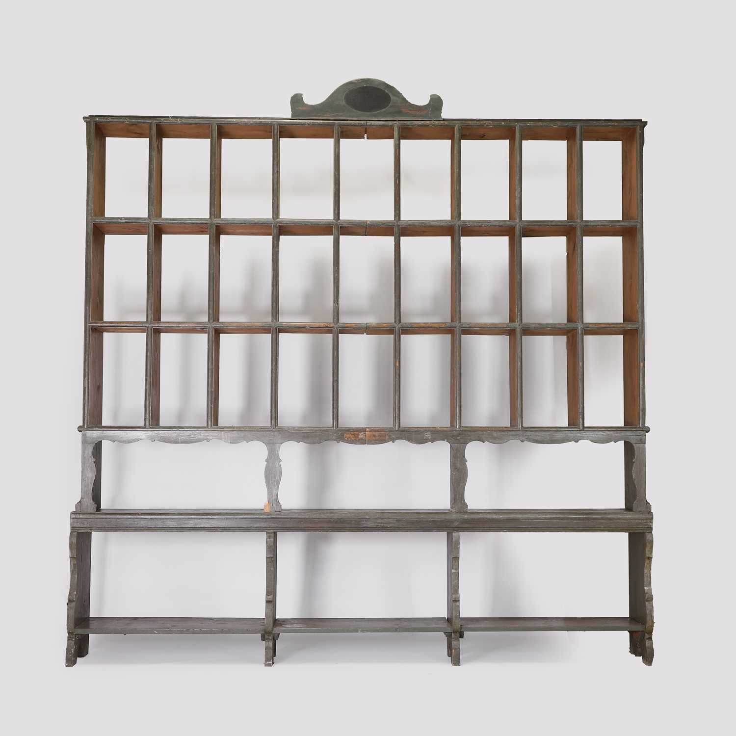 Lot 44 - A painted pine shop display shelf
