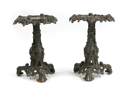 Lot 681 - A pair of cast iron tables