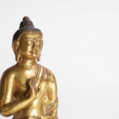 Lot 339 - A Tibetan gilt-bronze Buddha