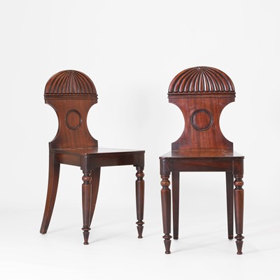 Lot 5 - A pair of Regency mahogany hall chairs