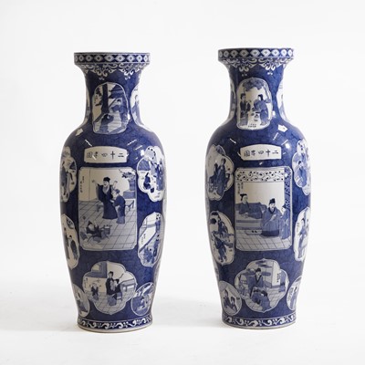 Lot 26 - A pair of blue and white porcelain baluster vases