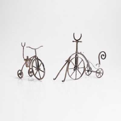 Lot 99 - A silver-plated tricycle bottle stand