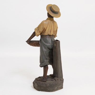 Lot 81 - A painted terracotta figure