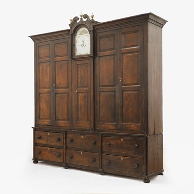 Lot 154 - A grained oak clock cupboard