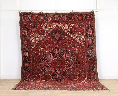 Lot 421 - A Heriz wool carpet