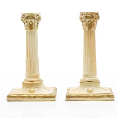Lot 163 - A pair or Royal Worcester porcelain candelabra