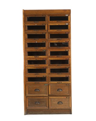 Lot 433 - An oak haberdashers cabinet