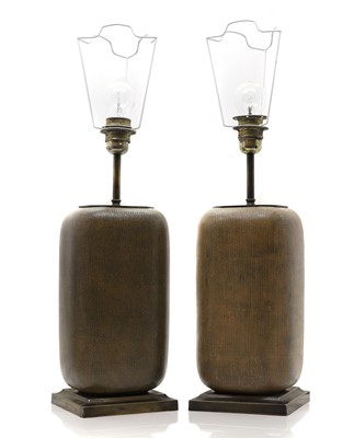 Lot 553 - A pair of earthenware lamps