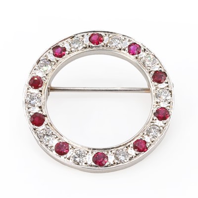 Lot 93 - A 9ct white gold ruby and diamond circle brooch