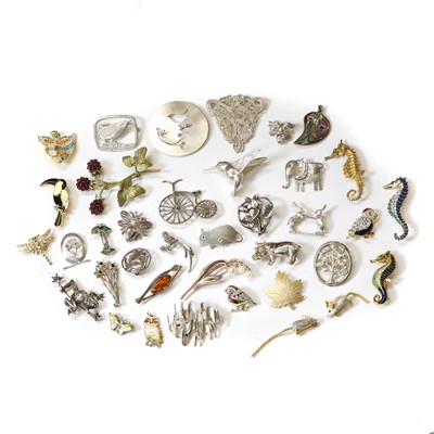 Lot 406 - A collection of silver, bronze and costume brooches and pendants