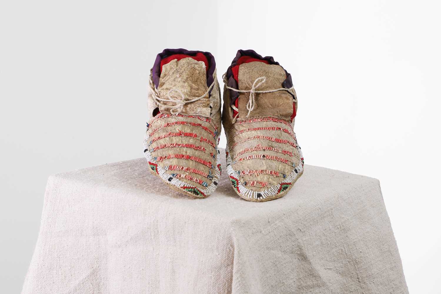 Lot 317 - A pair of Native American beaded and quilled hide moccasins